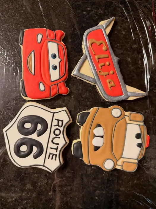 Cars movie cookies: a red race car, a Route 66 sign, a tow truck and a name cookie
