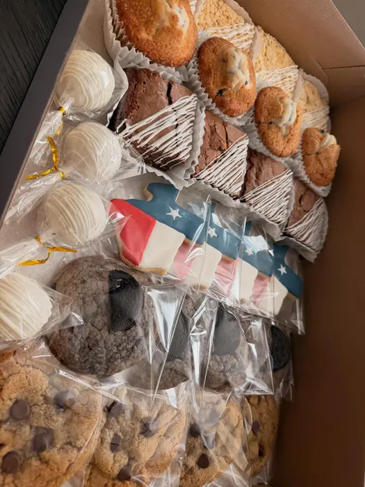 An assortment of bagged cookies and treats including an American flag design
