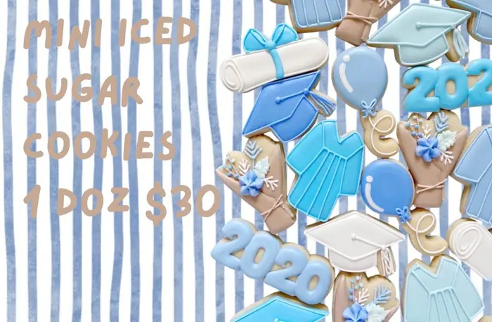 Mini iced sugar graduation cookies in blue and white