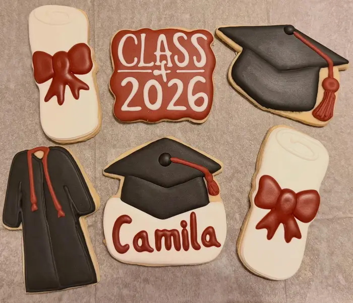 Graduation cookies for Camila with a cap, gown, diploma and Class of 2026