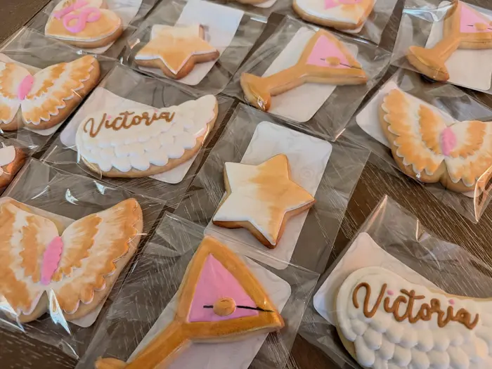 Close view of the gold and white angel wing cookies