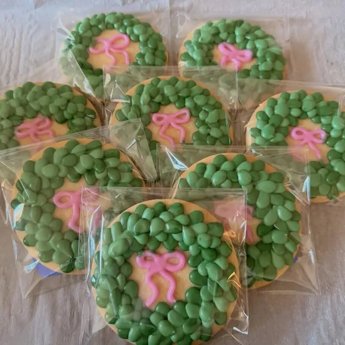 Wrapped Christmas wreath cookies with pink bows